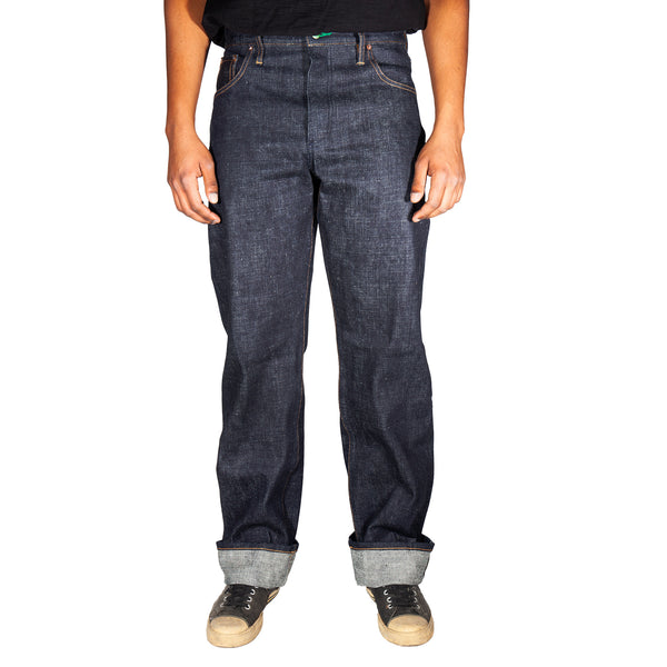 Person wearing dark blue jeans on a white background