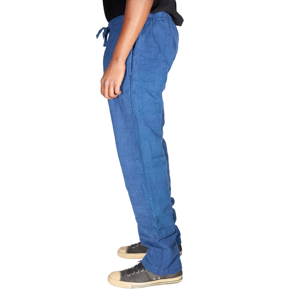 Person wearing blue pants on a white background