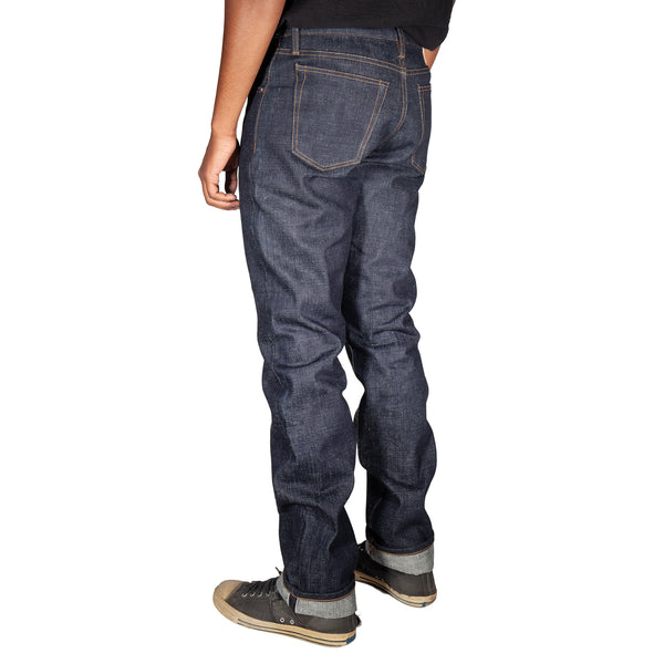 Person wearing blue jeans on a white background