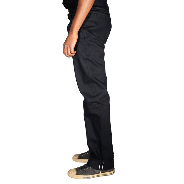 Person wearing black pants on a white background