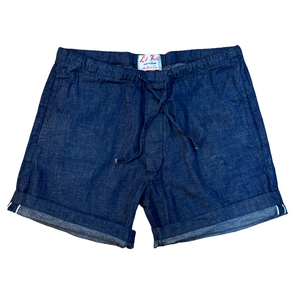 Blue shorts with a brand label on a white background