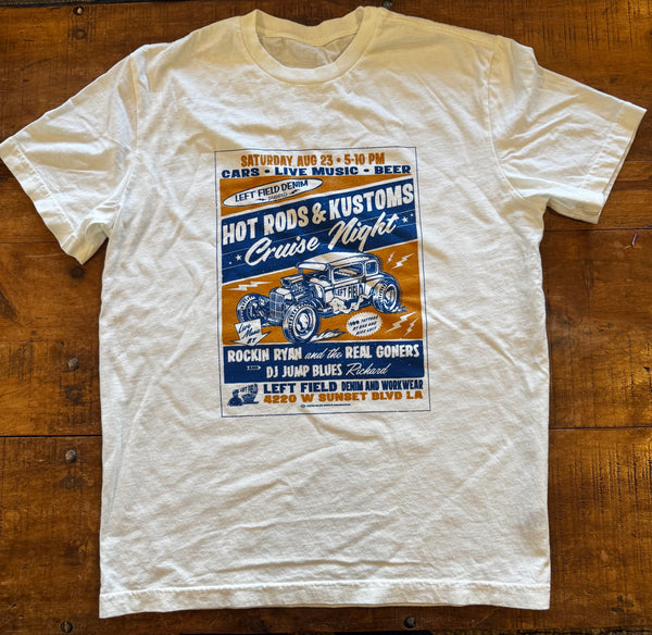 White t-shirt with a graphic design on a wooden surface