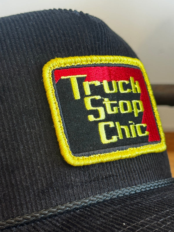 Patch with 'True Stop Chic' text on a black background