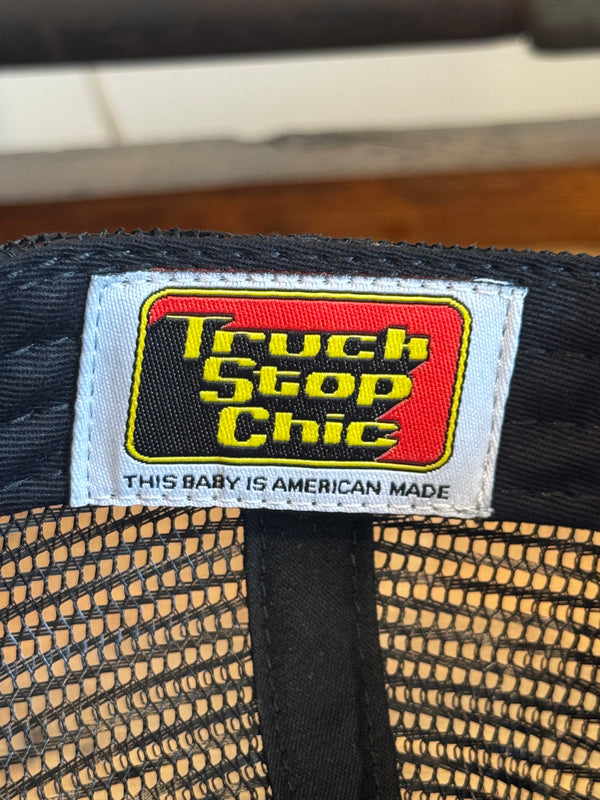 Close-up of a label on a product with text and a logo.