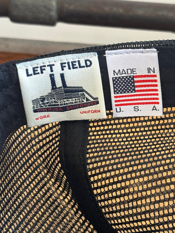 Close-up of a hat with a 'Made in USA' label and 'Left Field' branding.