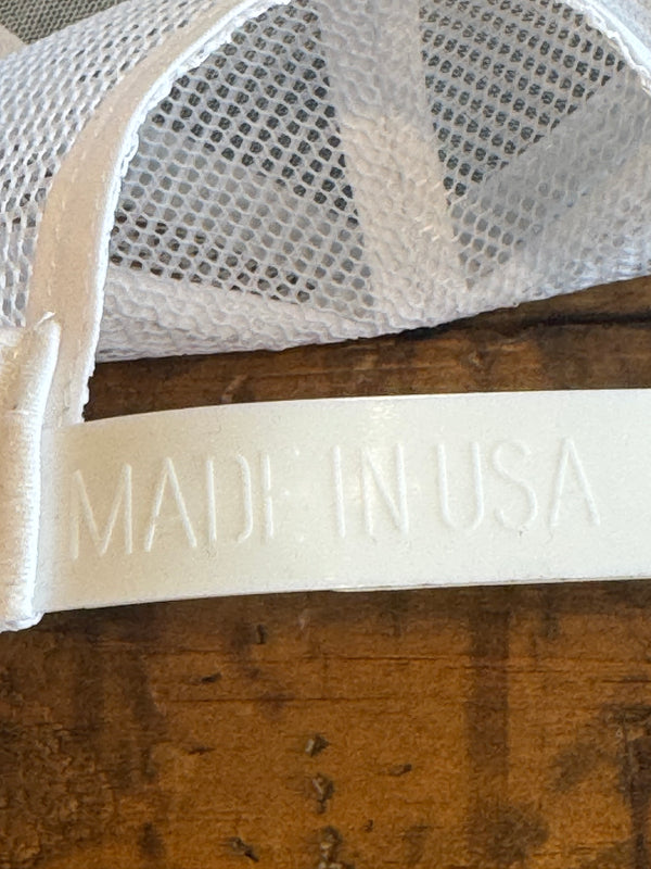White mesh screen with 'MADE IN USA' label on a wooden surface