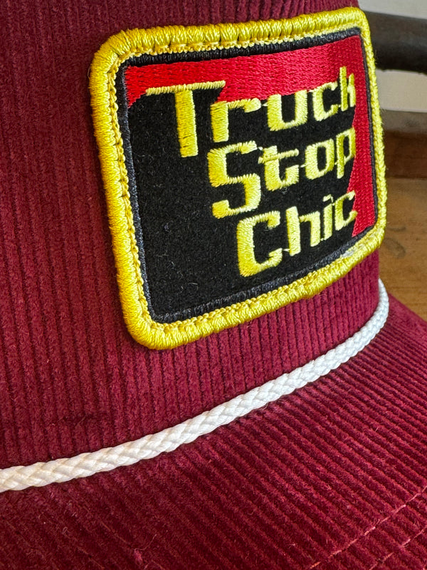 Patch on a maroon jacket with text and yellow border