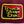 Close-up of a maroon bag with a yellow and red logo featuring text.