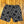 Black and white patterned shorts on a wooden floor