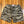 Camouflage shorts on a wooden surface
