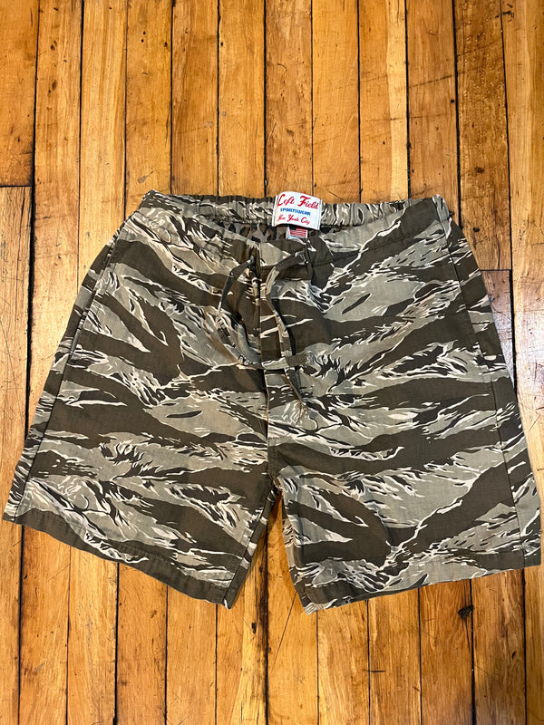 Camouflage shorts on a wooden surface