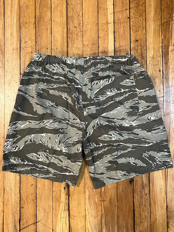Camouflage shorts on a wooden surface