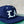Navy blue cap with 'LA' logo on a blurred background