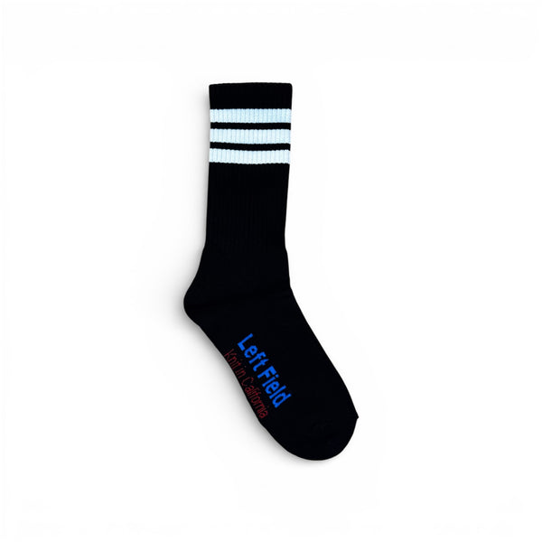 Black sock with white stripes and 'Left Field' branding on a white background