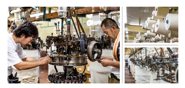 Workers assembling mechanical parts in a factory setting.
