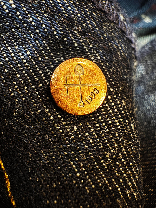 Gold tack button