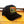 Black trucker hat with 'Truck Stop Chic' logo on a wooden surface