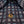 Close-up of a patterned shirt with a gold button