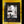 A square black book or album cover titled 'DICE 113' lies on a yellow wooden surface. The cover features a monochrome photograph of a person sitting on a motorcycle in front of a weathered wall, framed by a thick black border.