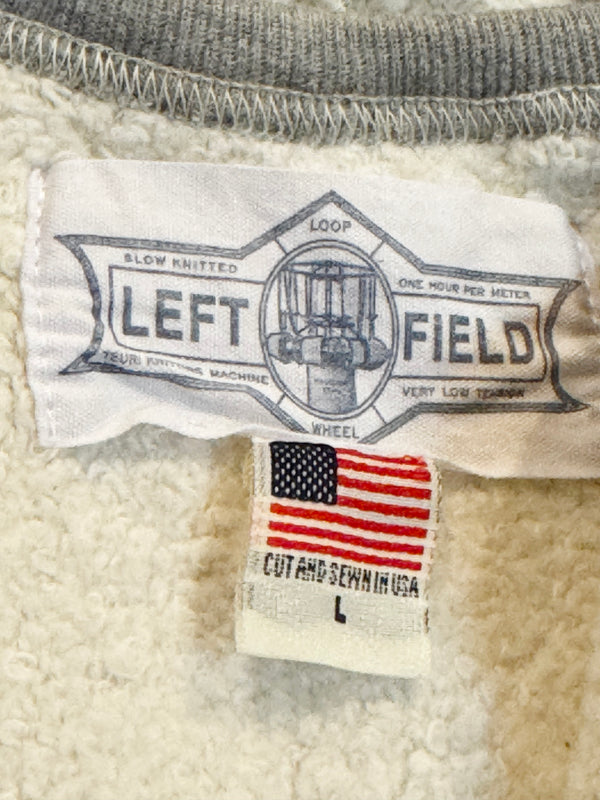 Close-up of a Left Field label on a textured fabric background