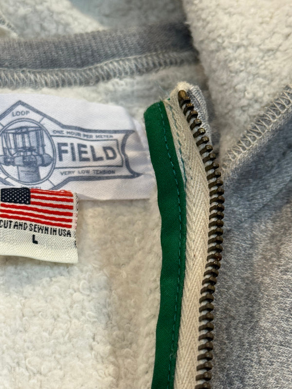 Close-up of a label on a textured fabric with a zipper.