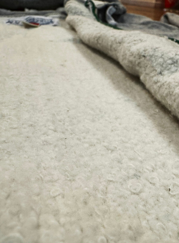 Close-up of textured fabric with a neutral color palette