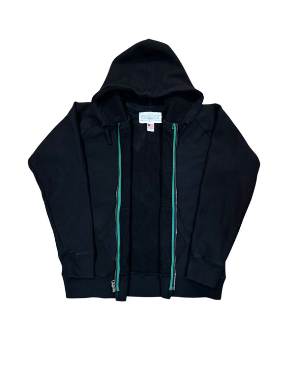 Black hoodie with a visible brand label on a white background