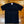 Black t-shirt with text on a wooden floor