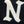 A close-up of a cream-colored embroidered letter 'N' on a black fabric surface.