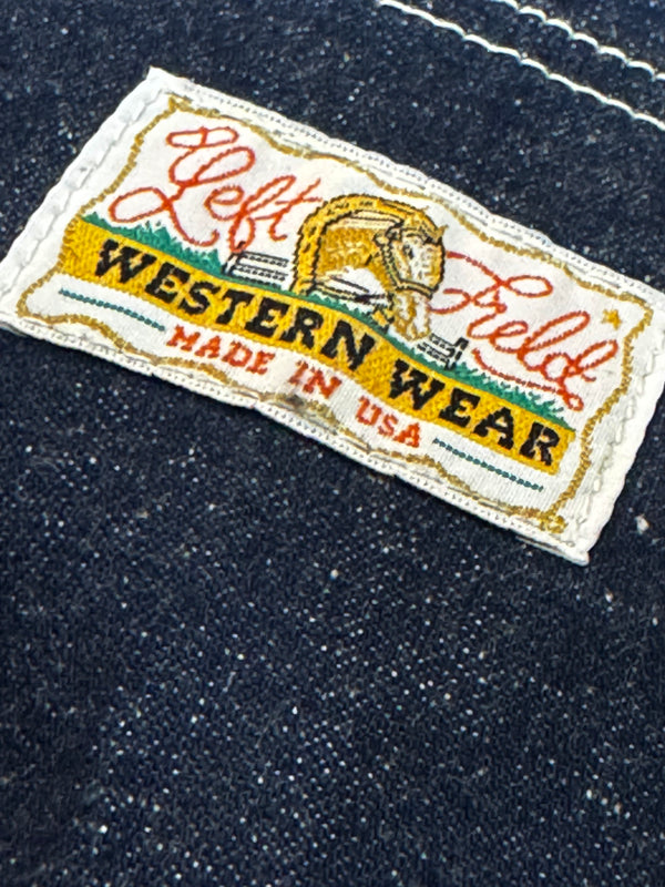 Label on denim fabric with 'Left Field Western Wear' branding