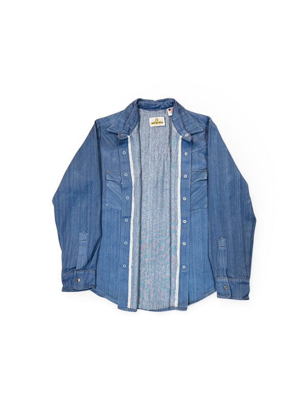 Blue denim shirt with a white label on a white background